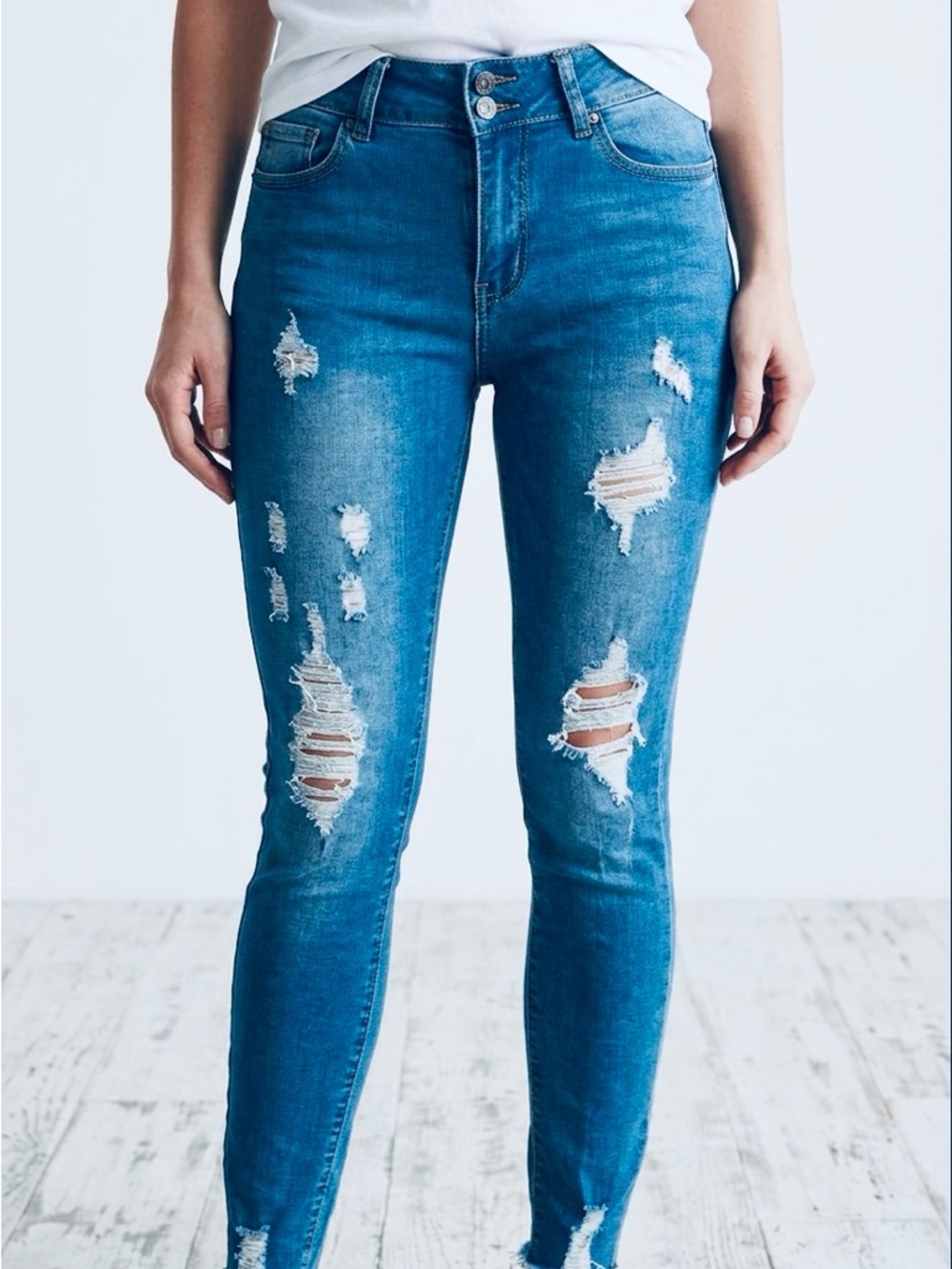 High-Rise Distressed Skinny Jeans in Medium Blue